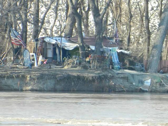 An encampment beside a waterway